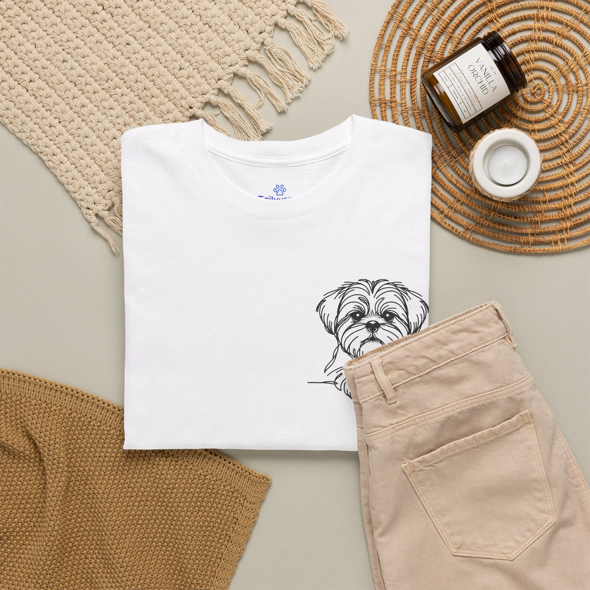 Lifestyle flat lay of white Tailyverze dog lover graphic T-shirt