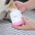 Dog paw being cleaned with a Pink Standard Paw Cleaner Cup